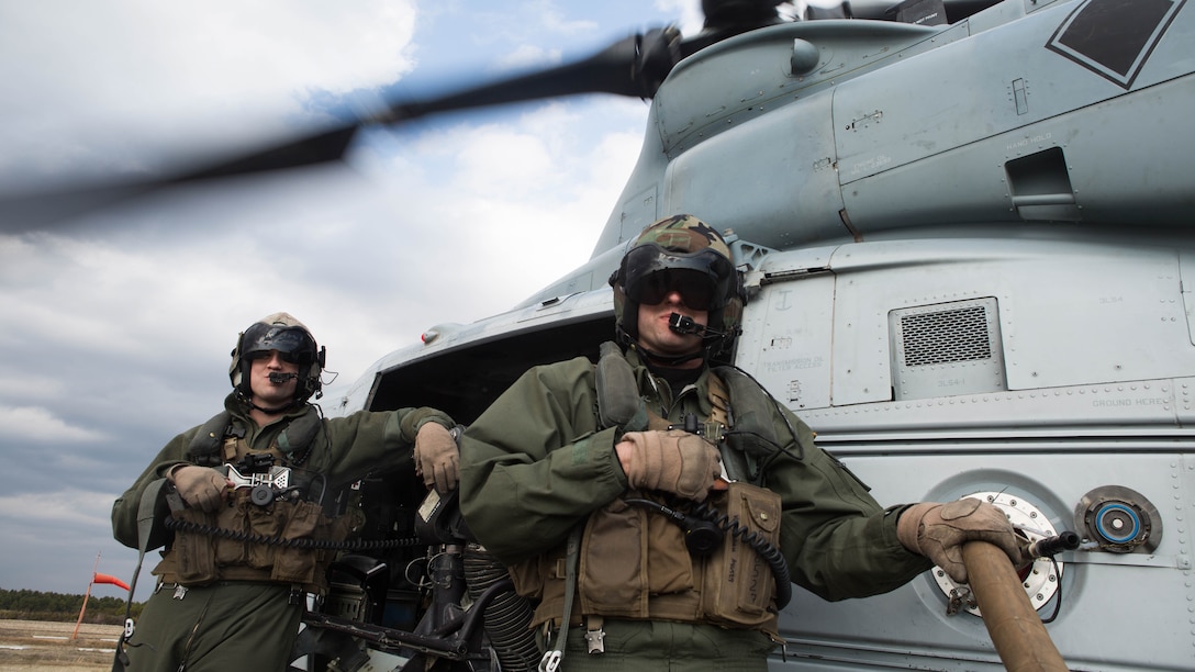 Two crew chiefs refuel their Bell UH-1Y Venom during Marine Wing Support Squadron 272’s forward arming and refueling point in Engelhard, N.C., Feb. 12, 2015. The squadron’s FARP exercise is designed to get the Marines to refuel landed helicopters as quickly as possible, so the aircrafts can quickly take off after filling up. 
