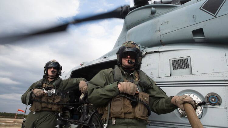 Two crew chiefs refuel their Bell UH-1Y Venom during Marine Wing Support Squadron 272’s forward arming and refueling point in Engelhard, N.C., Feb. 12, 2015. The squadron’s FARP exercise is designed to get the Marines to refuel landed helicopters as quickly as possible, so the aircrafts can quickly take off after filling up. 
