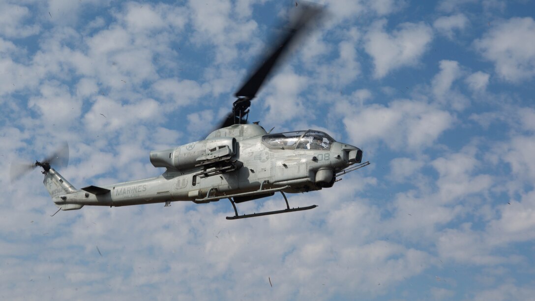 An AH-1W Super Cobra prepares to land during Marine Wing Support Squadron 272’s forward arming and refueling point in Engelhard, N.C., Feb. 12, 2015. The Marines established a refueling point, and multiple helicopters landed to refuel and take off again as quickly as possible. 