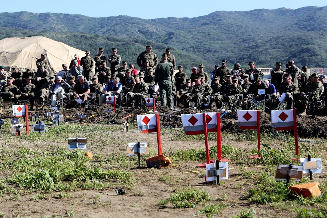 Marines listen as a I Marine Expeditionary Force subordinate command element representative gives a brief during a rehearsal of concepts drill during the I Marine Expeditionary Force Exercise 2015 aboard Marine Corps Base Camp Pendleton, Calif., Feb. 17. The exercise allowed service members the ability to rehearse and execute various task on the MEF level for the first time in more than ten years.