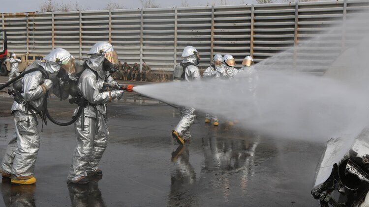 U.S. Marines and Royal Thai Navy firefighters practice extinguishing fires on an old airplane during exercise Cobra Gold 2015 Feb. 18, 2015, at Utapao Royal Thai Navy Airfield, Kingdom of Thailand. The bilateral force used three trucks and multiple response teams cycled through the hose teams to extinguish the fire. Exercise Cobra Gold is an annual exercise designed to improve international partnerships and security within the region. 