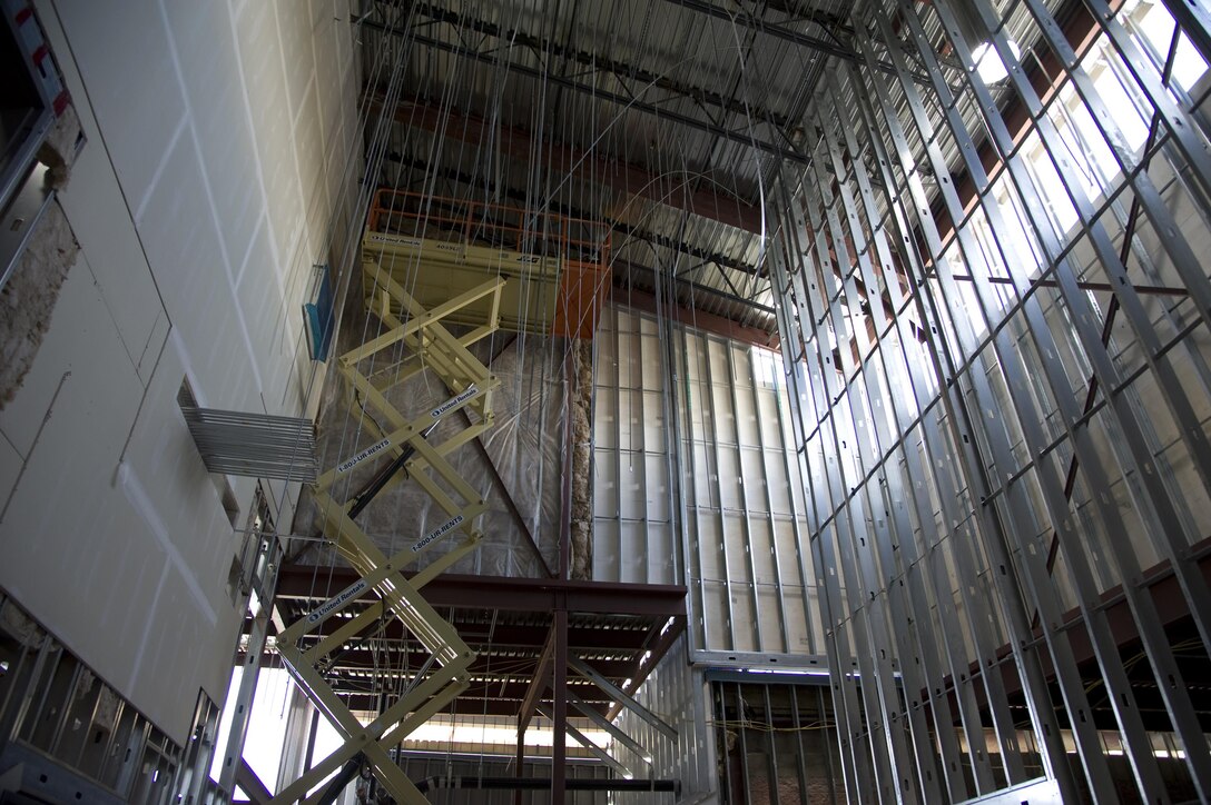 Dozens of bolts hang from the ceiling that will support the massive and sophisticated ventilation system for the annex to the life sciences test facility at Dugway Proving Ground, Utah. When completed, the building will be sealed and have negative pressure, to draw all atmosphere to central points for filtering, before return outdoors. (Cropped for emphasis)