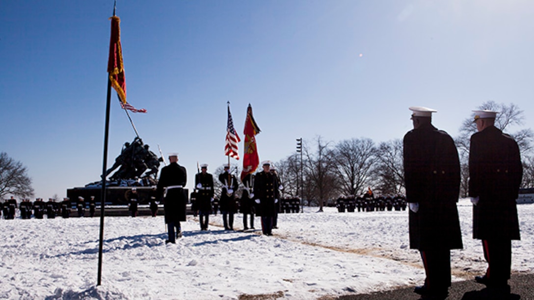 Sergeant Major Micheal Barrett, the 17th sergeant major of the Marine Corps, stands ready to retire from active duty in the Marine Corps during the sergeant major of the Marine Corps post and relief ceremony at the Marine Corps War Memorial in Arlington, Virginia, February 20, 2015. Barrett has served in the Marines since 1981.