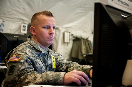 Master Sgt. David Henzler of the 404th Maneuver Enhancement Brigade mans the Protections stations during the 2015 Warfighter training exercise. The 404th MEB recently took part in the 2015 Warfighter Exercise at Camp Atterbury, Indiana. Warfighter is a two-week strategic exercise including over 3,000 service members from the Army and Air National Guard, Army Reserves, Active Army, and Canadian Forces.