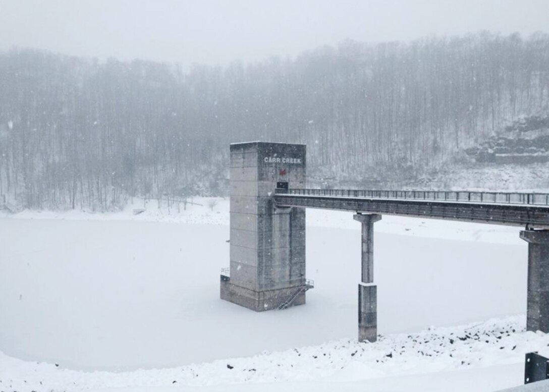 The control tower is visible through the snow at Carr Creek Lake, Sassafras, Ky.