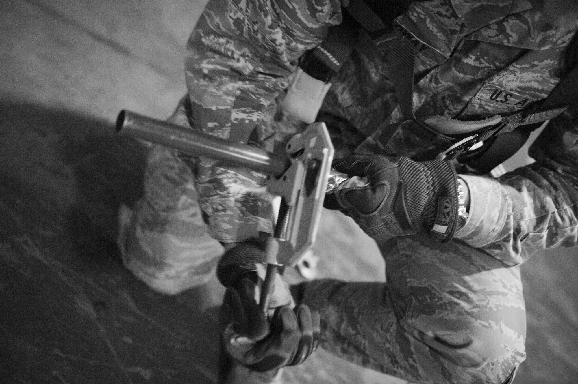 Staff Sgt. Elliot Holloway, 1st Special Operations Civil Engineer Squadron electrical systems craftsman, cuts a conduit on Hurlburt Field, Fla., Feb. 18, 2015. Conduits are used to protect wiring. (U.S. Air Force photo/Senior Airman Krystal M. Garrett)