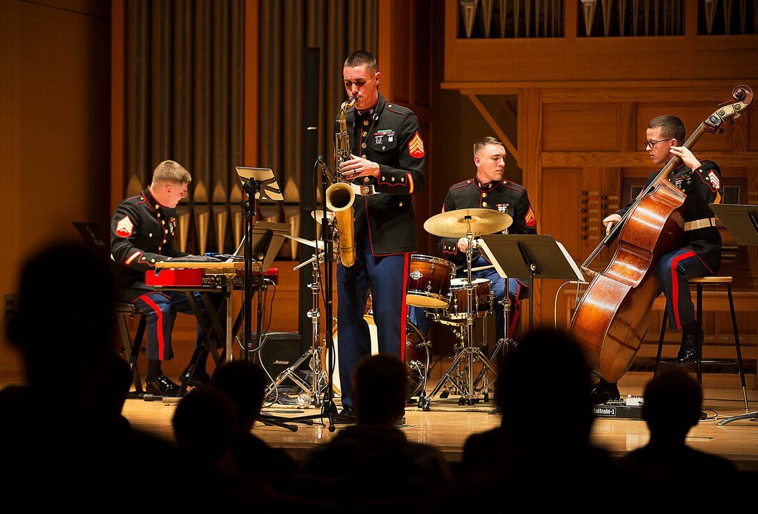 Marine Band San Diego's jazz combo performs during a concert for Central Washington University students in Ellensburg, Washington, Feb. 17, 2015. Following an intensive audition and screening process, Marine Band applicants attend recruit training and Marine Combat Training. Next, they attend a six-month basic music course at the Armed Forces School of Music in Norfolk, Virginia, where they study theory, ear training, private instrumental lessons, ensemble instruction and marching techniques. When their initial training is complete, they are assigned to one of 12 field bands in the continental U.S., Hawaii or Japan. The Marine Corps also supports "The Commandant's Own" Drum & Bugle Corps and "The President's Own" United States Marine Band. (U.S. Marine Corps photo by Sgt. Reece Lodder)