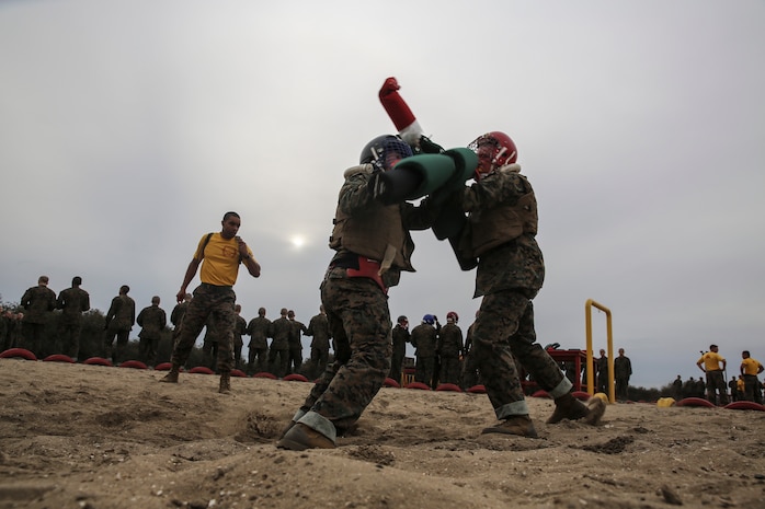 Recruits from Hotel Company, 2nd Recruit Training Battalion, fight each other during a pugil stick bout at Marine Corps Recruit San Diego, Jan. 28. Recruits of Hotel Company will endure Pugil Sticks three more times before they earn the title of Marine.