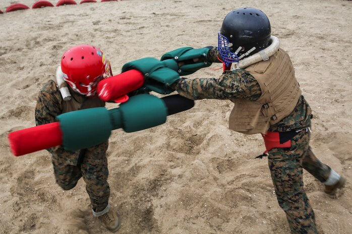 Recruits from Hotel Company, 2nd Recruit Training Battalion, fight each other during a pugil stick bout at Marine Corps Recruit San Diego, Jan. 28. Prior to the Pugil Sticks event, recruits learned their first set of bayonet techniques and later they were required to apply during each of their bouts.