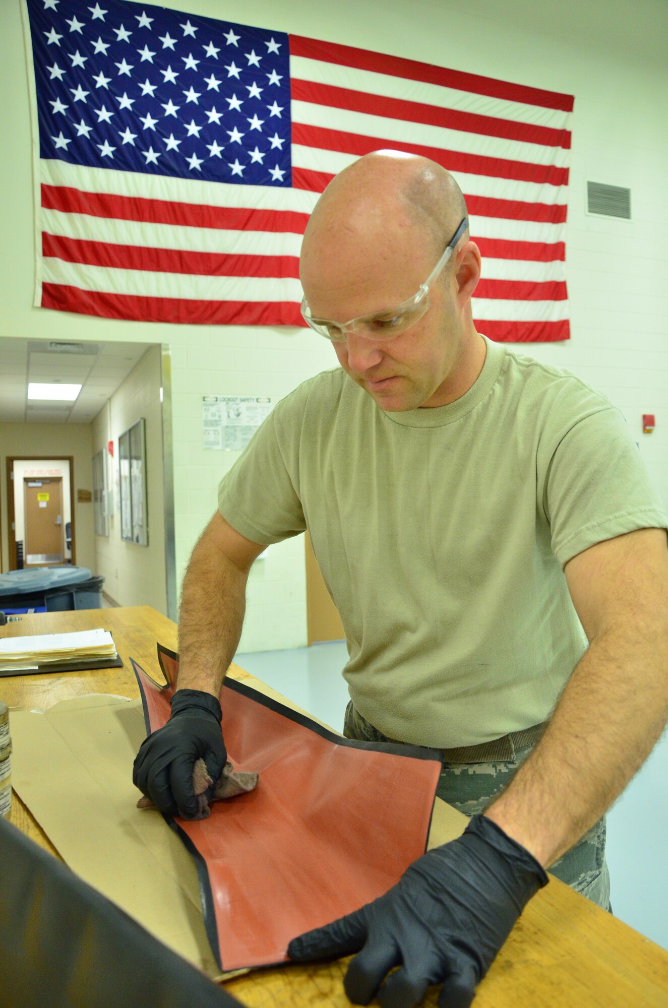 Step one: Tech Sgt. Ronnie Graham, a turboprop craftsman with the 403rd Maintenance Squadron, preps the inside of a rubber sleeve with acetone 11 Feb in the Roberts Consolidated Maintenance Facility at Keesler Air Force Base.. The rubber sleeve fits onto the leading edge of a propeller of a C-130J aircraft during a replacement procedure. (U.S. Air Force Photo/Master Sgt. Brian Lamar)