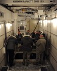 Members of the Nuclear Oversight Board observe as they are briefed about the
operations at the Uniform-01 Missile Maintenance Trainer site on Minot Air
Force Base, N.D., Feb. 19 2015. This NOB is being held at Minot AFB in order
to provide Air Force leadership with exposure to both the bomber and
Intercontinental Ballistic Missile missions, and experience first-hand the
unique environmental challenges of a northern tier base. (U.S. Air Force
photo/Senior Airman Kristoffer Kaubisch)
