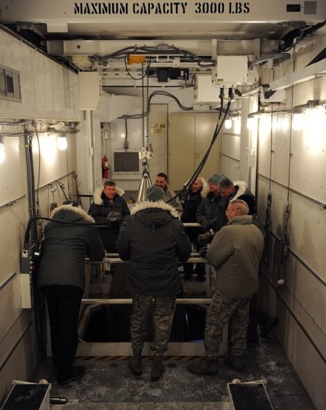 Members of the Nuclear Oversight Board observe as they are briefed about the
operations at the Uniform-01 Missile Maintenance Trainer site on Minot Air
Force Base, N.D., Feb. 19 2015. This NOB is being held at Minot AFB in order
to provide Air Force leadership with exposure to both the bomber and
Intercontinental Ballistic Missile missions, and experience first-hand the
unique environmental challenges of a northern tier base. (U.S. Air Force
photo/Senior Airman Kristoffer Kaubisch)