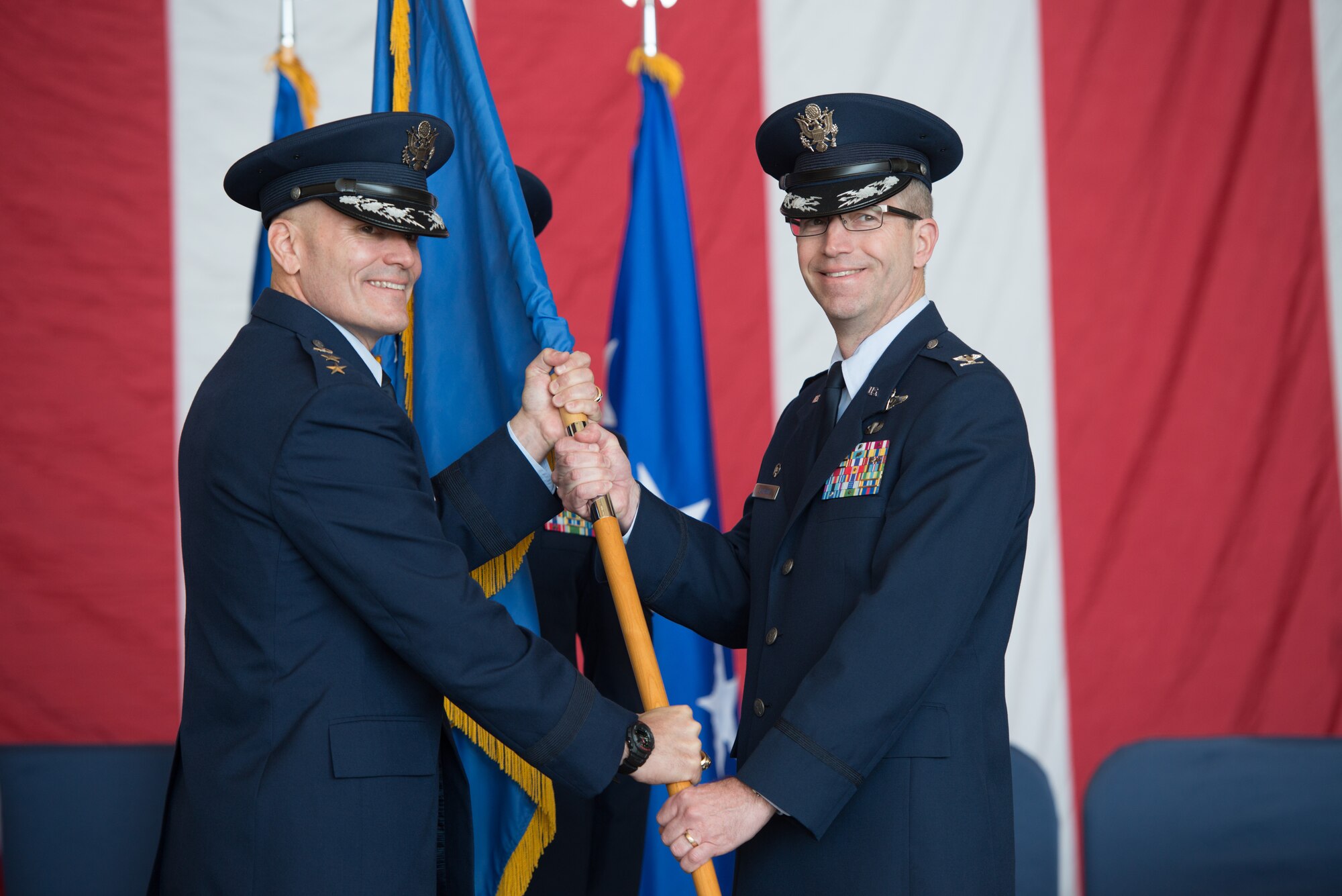 Command of the 60th Air Mobility Wing changes hands at Travis AFB, Calif., Feb. 20, 2015. Lt. Gen. Carlton Everhart II, 18th Air Force commander, presided over the ceremony where Col. Corey Martin relinquished command, and Col. Joel Jackson took command of the Air Mobility Command's largest wing. This is the fourth time Jackson has served at Travis, after having commanded at the squadron and group level earlier in his career. (U.S. Air Force photo/Ken Wright)