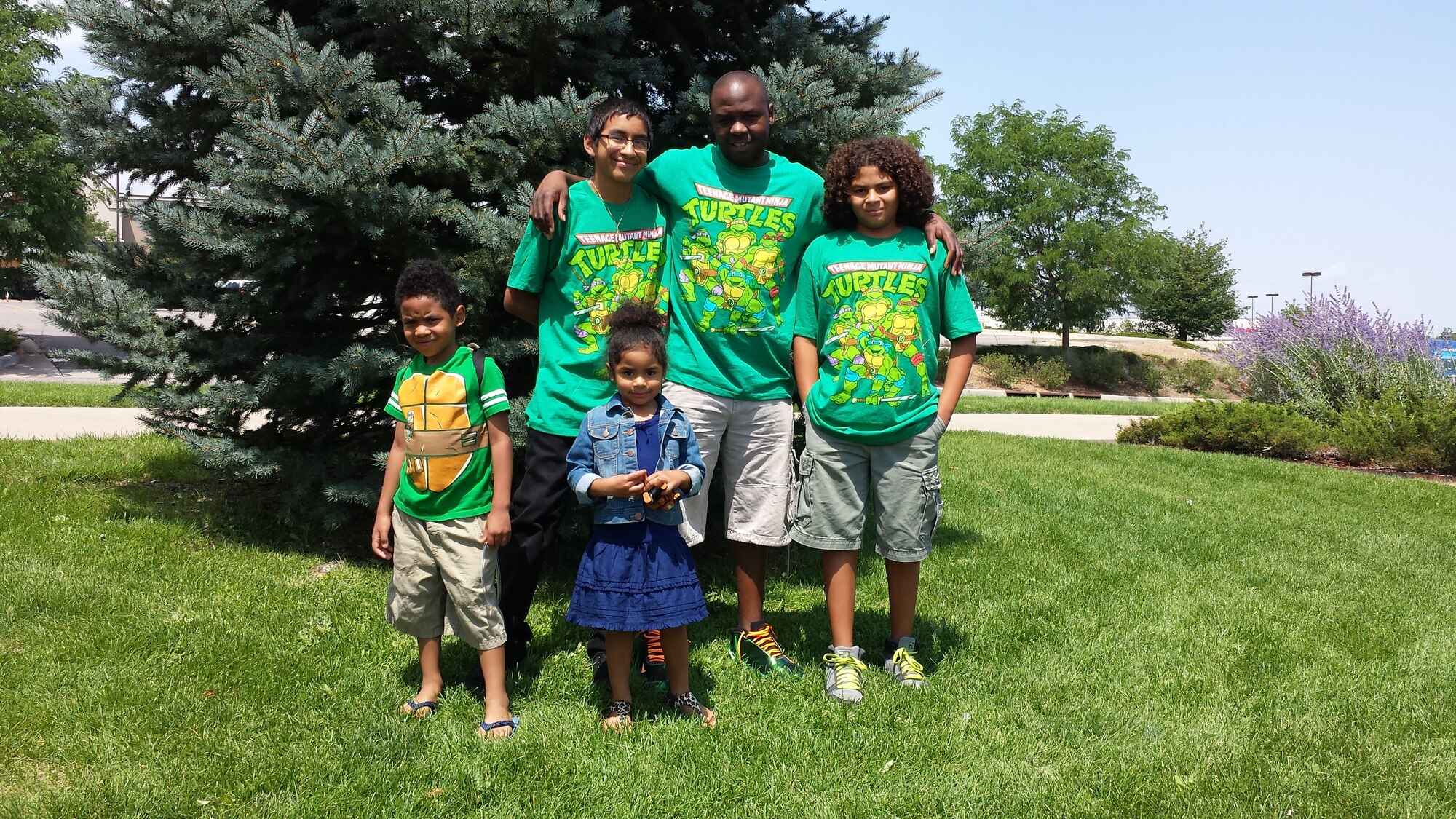 Ernesto Flores, Buckley's Military Youth of the Year, back left, stands with his family before seeing the Teenage Mutant Ninja Turtle movie. (courtesy photo)