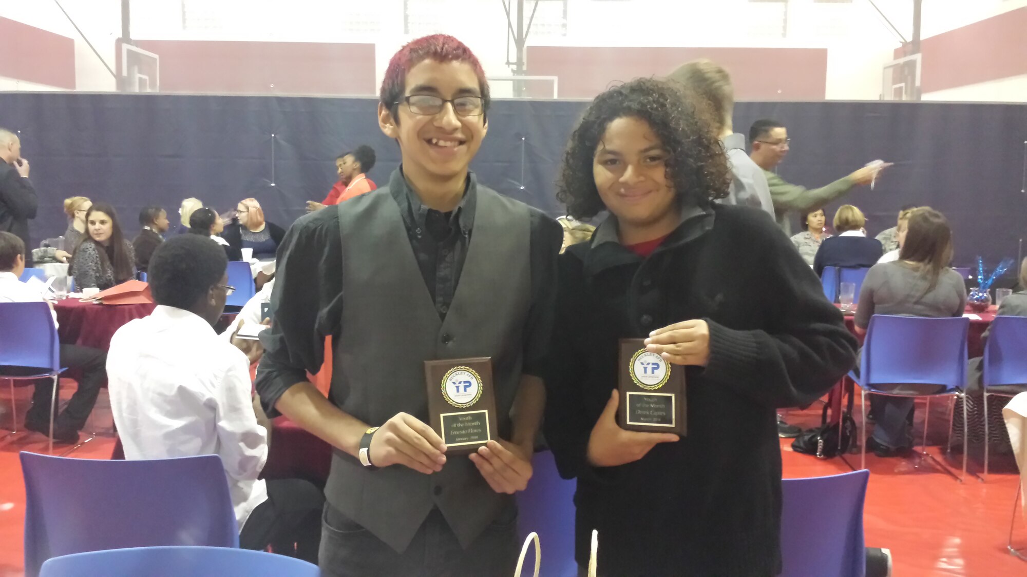 Ernesto Flores, Buckley's Military Youth of the Year, left, and his brother, Derick, right, show off their Military Youth of the Month awards. (courtesy photo)