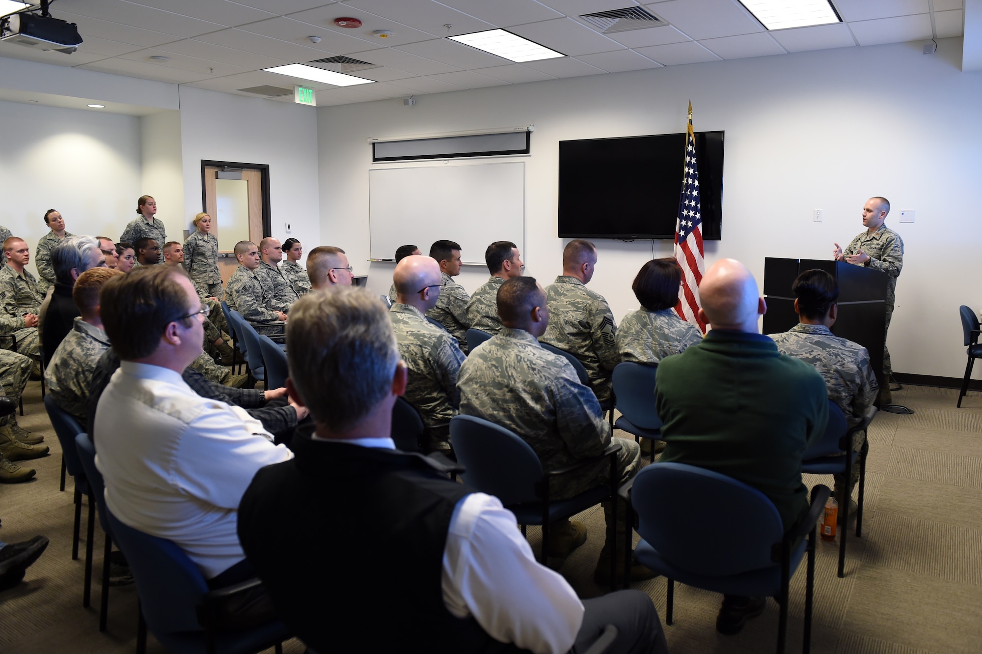 Maj. Jason Stack, 460th Security Forces Squadron commander, speaks during the Base Defense Operations Center ribbon cutting ceremony Feb. 19, 2015, on Buckley Air Force Base, Colo. The BDOC ribbon cutting ceremony took place to recognize the new BDOC being opened in the 460th SFS building. (U.S. Air Force photo by Airman 1st Class Emily E. Amyotte/Released)