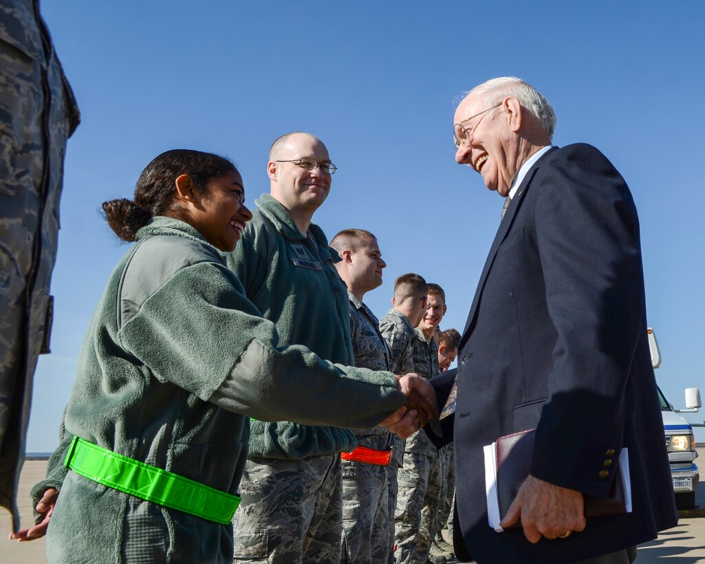 Sam Parish, the eighth chief master sergeant of the Air Force, meets Airman 1st Class Amparo Tovar, 7th Component Maintenance Squadron avionics test station and components journeyman, during his visit Feb. 13, 2015, at Dyess Air Force Base, Texas. Parish was given a tour of the base where he offered advice and words of encouragement to various groups of Airmen. He also served as the guest speaker for the Airman Leadership School graduation, the 2015 Team Dyess Annual Awards Banquet and an enlisted all-call. (U.S. Air Force photo by Airman 1st Class Kedesha Pennant/Released)