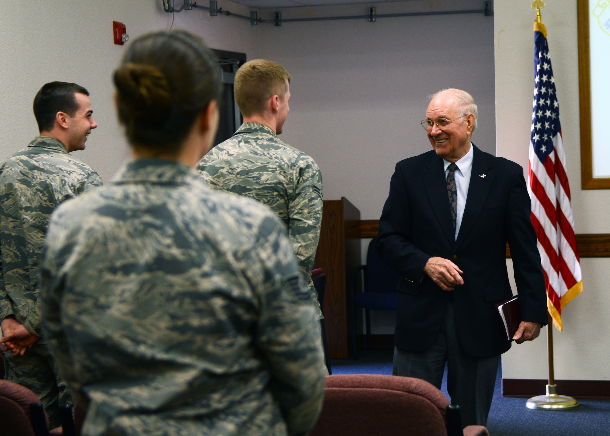 Retired Chief Master Sgt. of the Air Force Sam Parish meets Airmen assigned to the 337th Test and Evaluation Squadron Feb. 13, 2015, at Dyess Air Force Base, Texas. During his tour of the 337th TES, Parish was briefed on the B-1B Lancer’s Link 16 system, which allows the B-1 to interact and exchange information with allied aircraft in real time. (U.S. Air Force photo by Airman 1st Class Kedesha Pennant/Released)