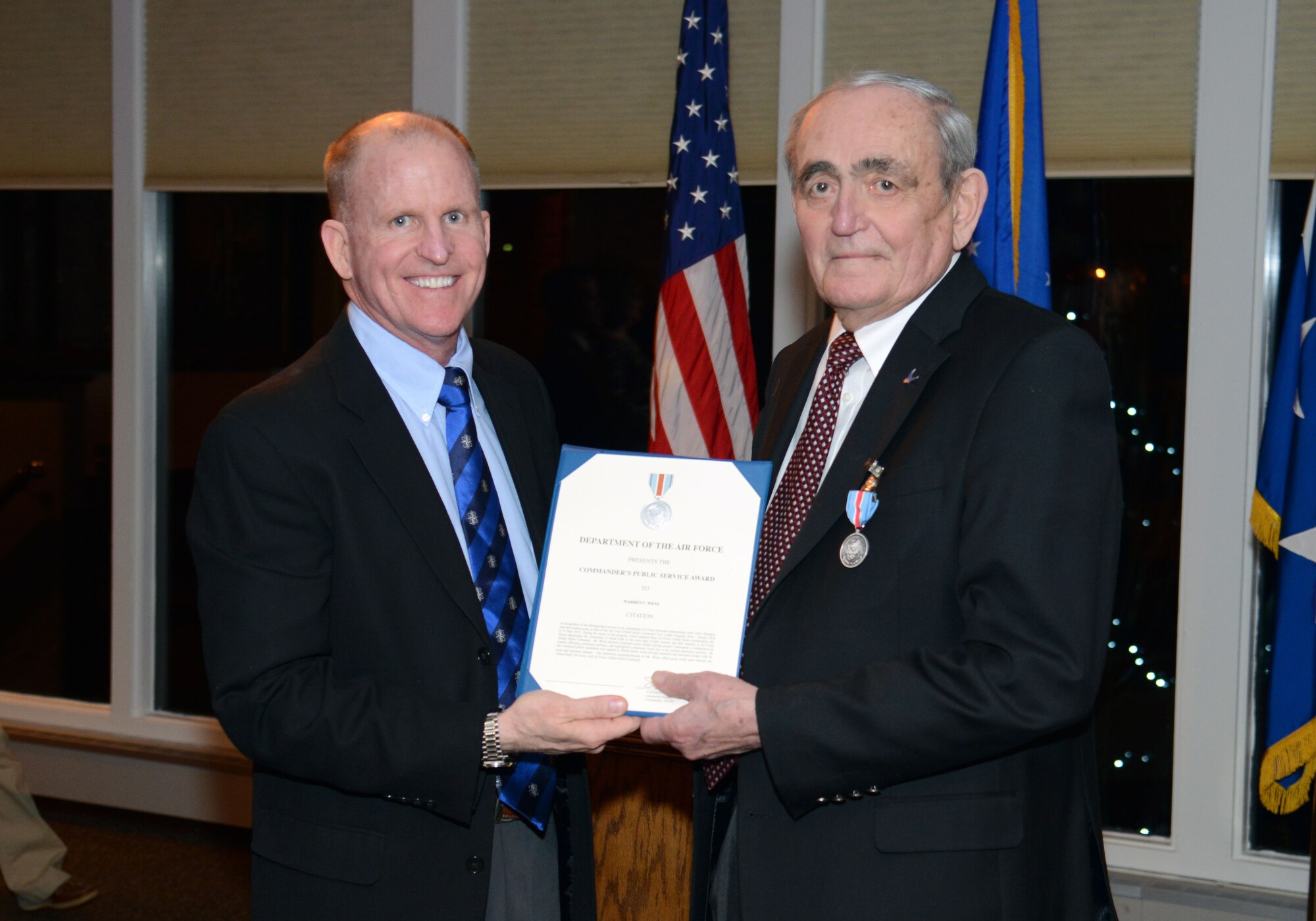 Lt. Gen. Stephen Wilson, left, Air Force Global Strike Command commander, poses with Warren Wenz, a longtime member of the Air Force Global Strike Command Civic Leader Program, after presenting him the Commanders Award for Public Service Feb. 18 at the Meadowlark Country Club in Great Falls, Mont. Wenz received the award for his long and dedicated commitment to the Air Force and the Great Falls area. (U.S. Air Force photo/ Airman 1st Class Dillon Johnston)
