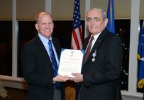 Lt. Gen. Stephen Wilson, left, Air Force Global Strike Command commander, poses with Warren Wenz, a longtime member of the Air Force Global Strike Command Civic Leader Program, after presenting him the Commanders Award for Public Service Feb. 18 at the Meadowlark Country Club in Great Falls, Mont. Wenz received the award for his long and dedicated commitment to the Air Force and the Great Falls area. (U.S. Air Force photo/ Airman 1st Class Dillon Johnston)