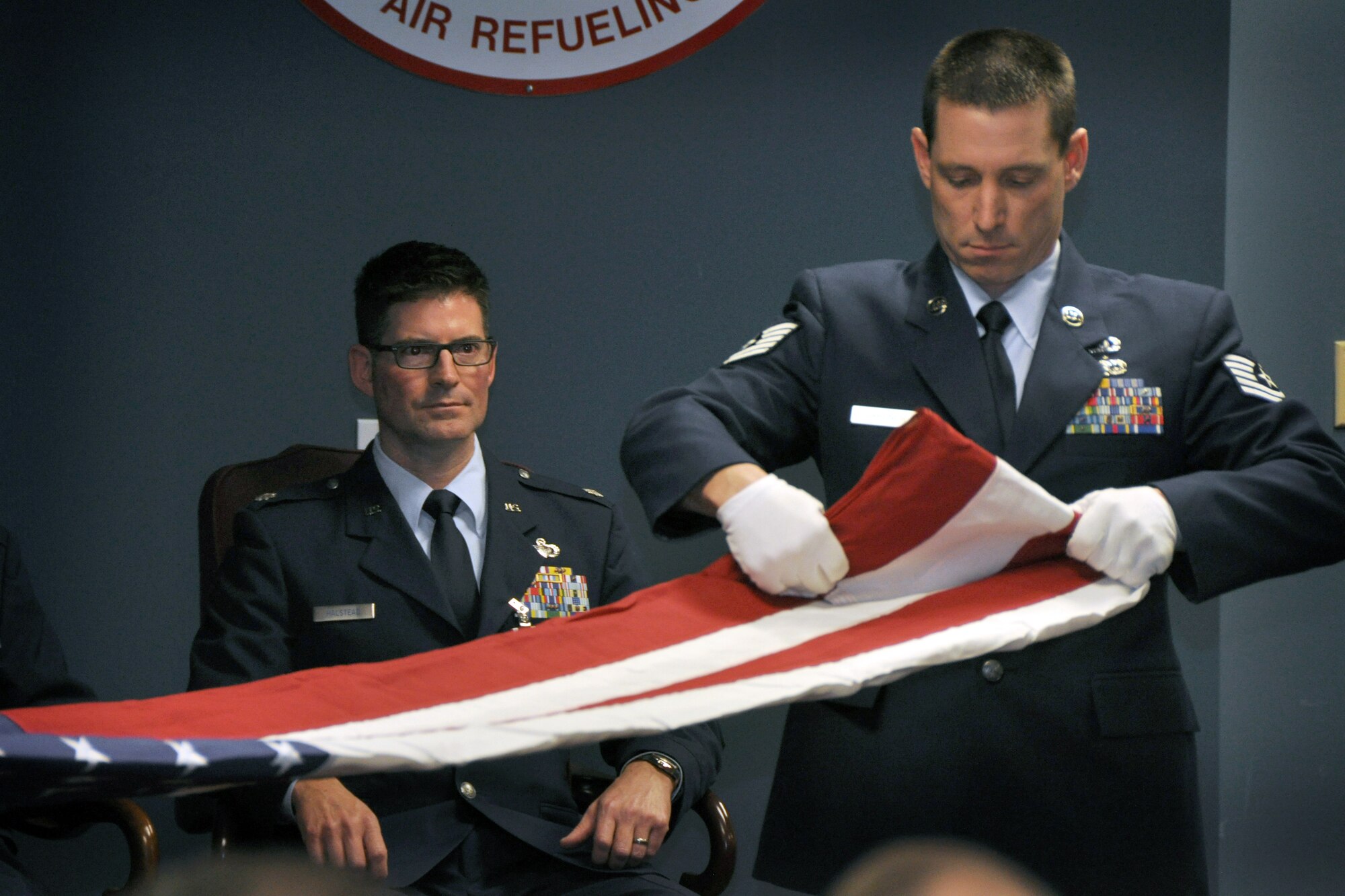 Lt. Col. Todd Halstead, 916th Operations Support Squadron, intently observes the flag folding demonstration during his retirement ceremony at Seymour Johnson Air Force Base, North Carolina, January 2015. (USAF photo by SSgt. Mark, Thompson, 916ARW/PA)