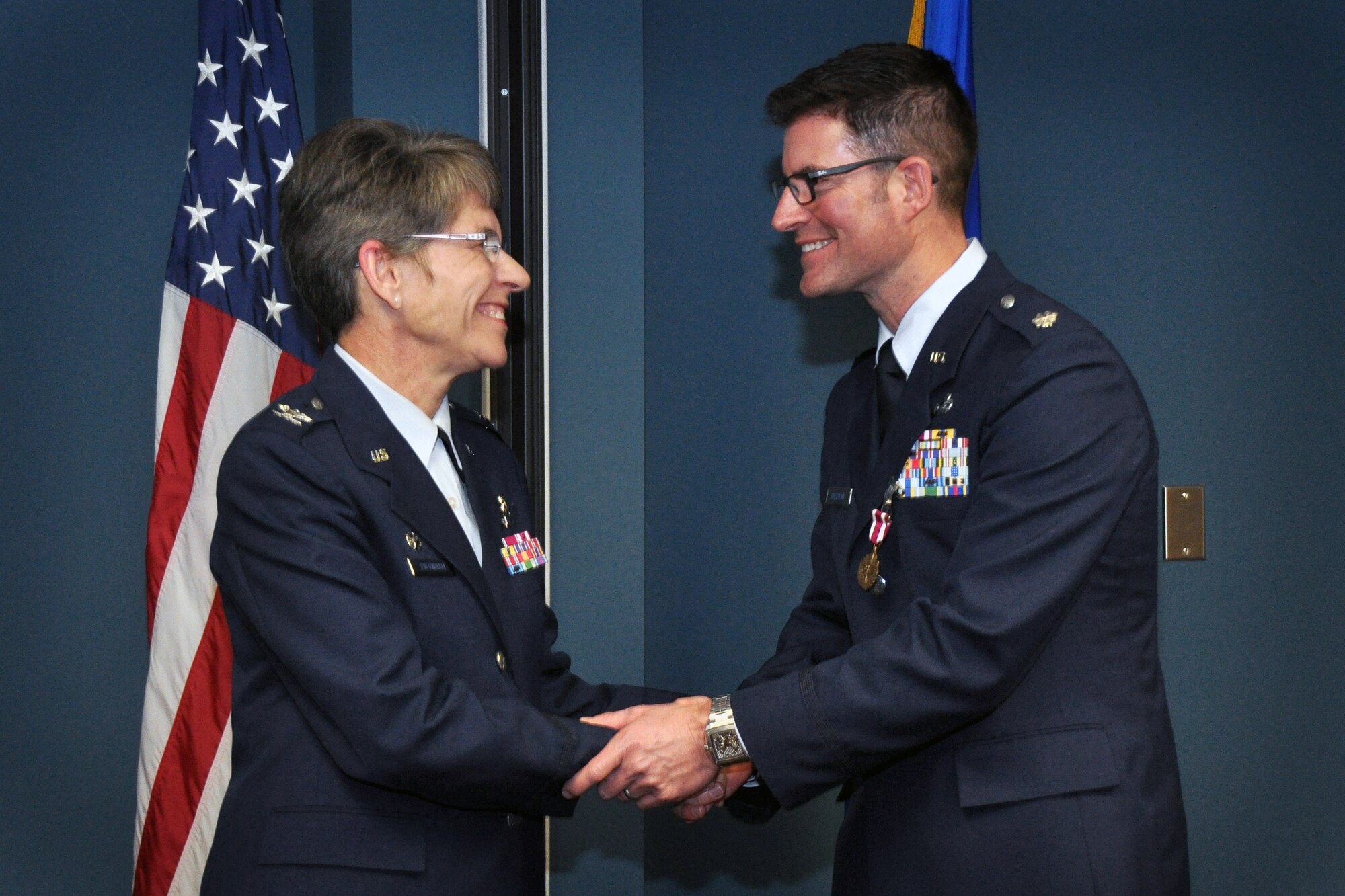 Lt. Col. Todd Halstead, 916th Operations Support Squadron, is congratulated by Col. Evernham, 315th Airlift Wing commander, during his retirement ceremony at Seymour Johnson Air Force Base, North Carolina, January 2015. (USAF photo by SSgt. Mark, Thompson, 916ARW/PA)