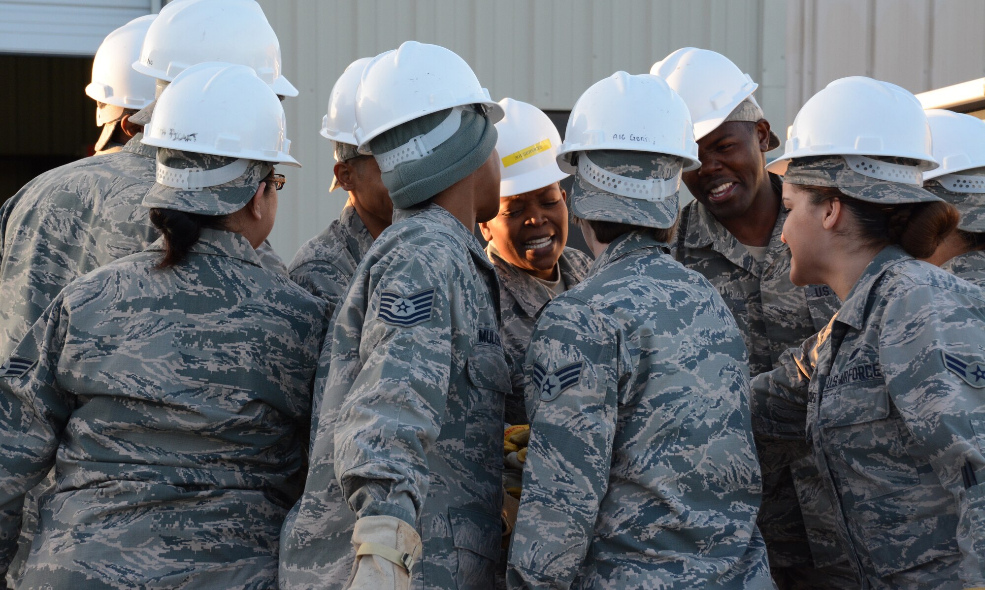NAVAL AIR STATION FORT WORTH JOINT RESERVE BASE, Texas - The 301st Services Flight 10-person team rallies together Feb. 7 before judging begins for their second Air Force Reserve Command Hennessy Trophy win here. The team formed a single pallet expeditionary kitchen (SPEK), then served 165 Airmen lunch. (U.S. Air Force photo by Staff Sgt. Samantha Mathison)
