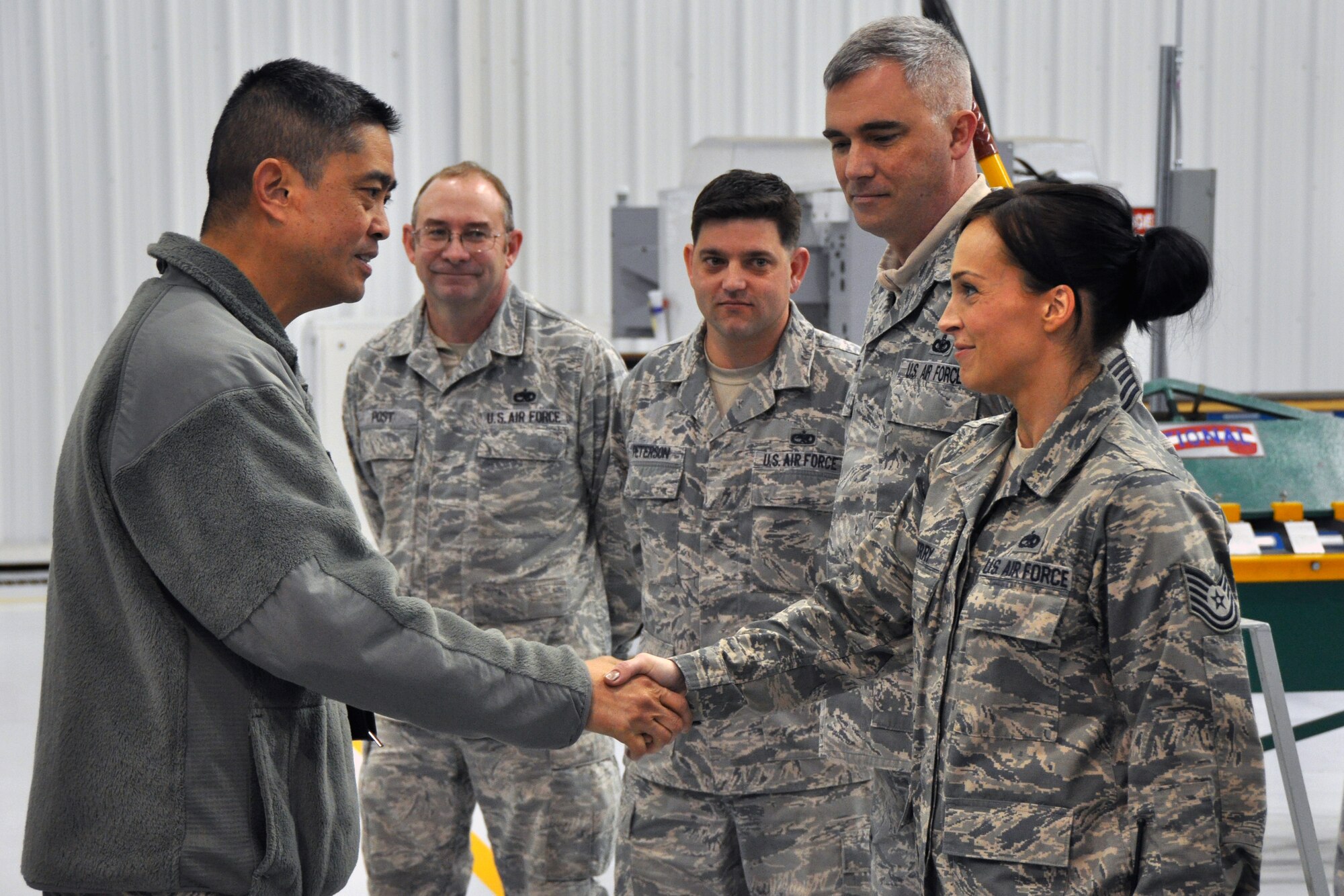 Chief Master Sgt. Brian Wong, 4th Air Force command chief, greets Tech. Sgt. Amy Perry, 916th Maintenance Squadron non-destructive inspection chief, and other maintenance personnel during a visit to Seymour Johnson Air Force Base, Jan. 10. Brig. Gen. John Flournoy Jr., 4th AF commander, and Wong visited to meet 916th Air Refueling Wing personnel and to observe Team Seymour execute its Total Force mission. (USAF photo by SSgt. Mark, Thompson, 916ARW/PA)