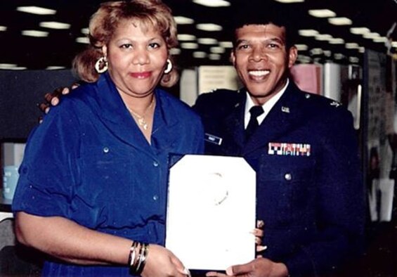 Col. Joseph C. Ramsey presents a certificate to Margaretta “Gretta” Burroughs in an undated photo. Ramsey was the first and only African-American commander at the Air Reserve Personnel Center when it was previously located at the former Lowry Air Force Base, Colorado. He served as the 21st ARPC commander from May 16, 1987 until Aug. 23, 1991. (U.S. Air Force courtesy photo)