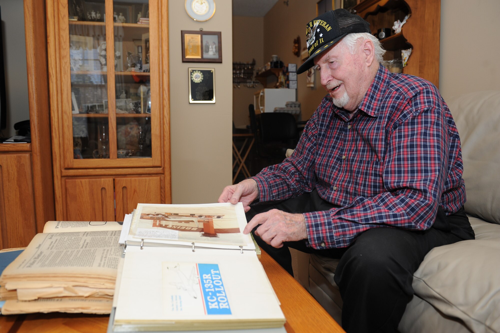 Glen Mishler, Air Force veteran and former Boeing mechanic, skims through a scrapbook of memorabilia highlighting important events from his life Feb. 18, 2015 in Andover, KS. Mishler was part of a test crew for the first KC-135Rs that eventually arrived at McConnell Air Force Base, KS, in 1984.