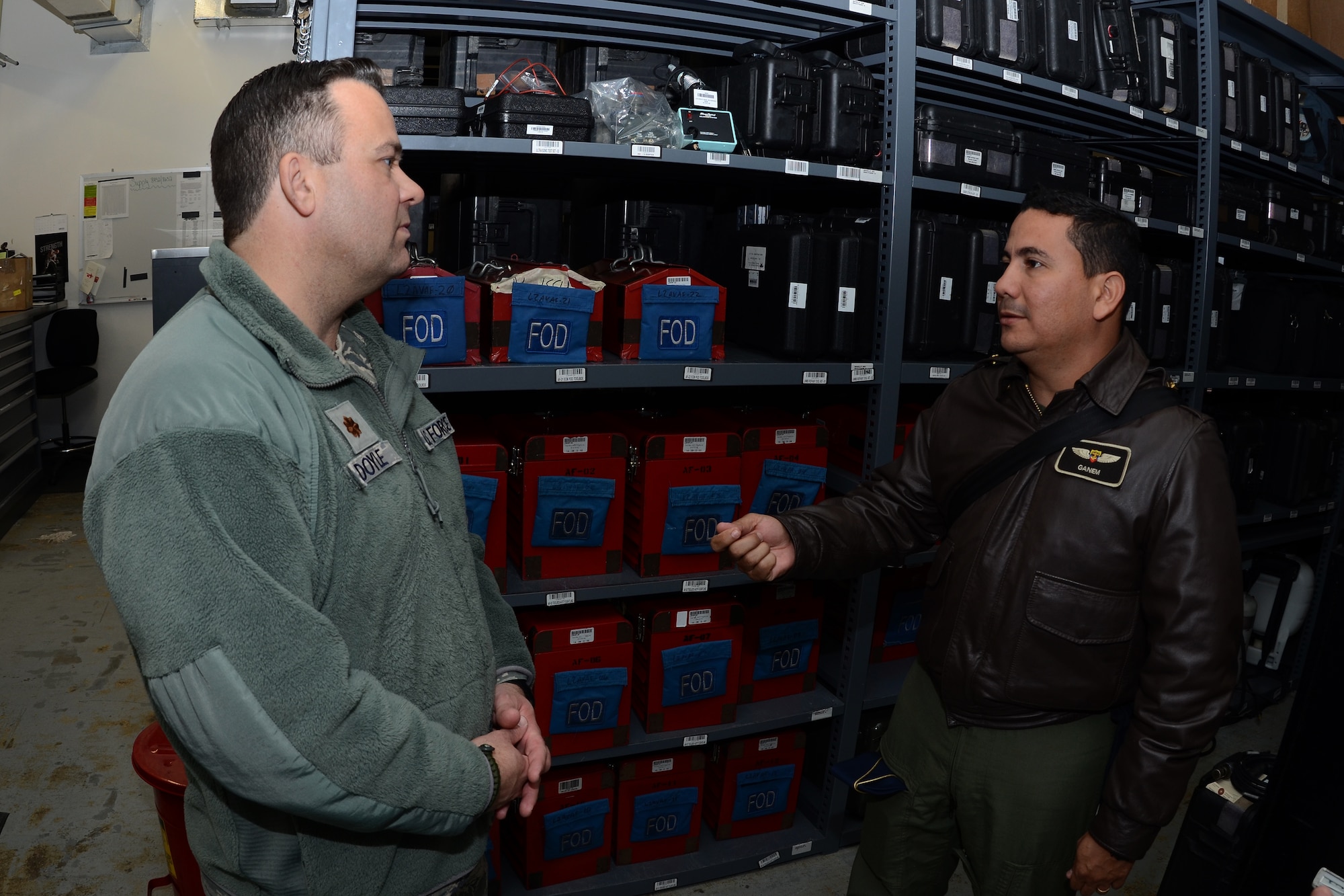 U.S. Air Force Maj. Brian Doyle, commander of the 169th Maintenance Operations Flight, shares common maintenance challenges and tool room management with Colombian Air Force maintenance officer Maj. Naily Ganem during a State Partnership Program (SPP) visit at McEntire Joint National Guard Base, S.C., Feb. 19, 2015. The Colombian Air Force sent a delegation of experts as a part of a three-day Key Leader Engagement and Subject Matter Expert exchange sharing information on flying and maintenance operations at McEntire JNGB and fostering relationships between the militaries. (U.S. Air National Guard photo by Senior Master Sgt. Edward Snyder/Released)