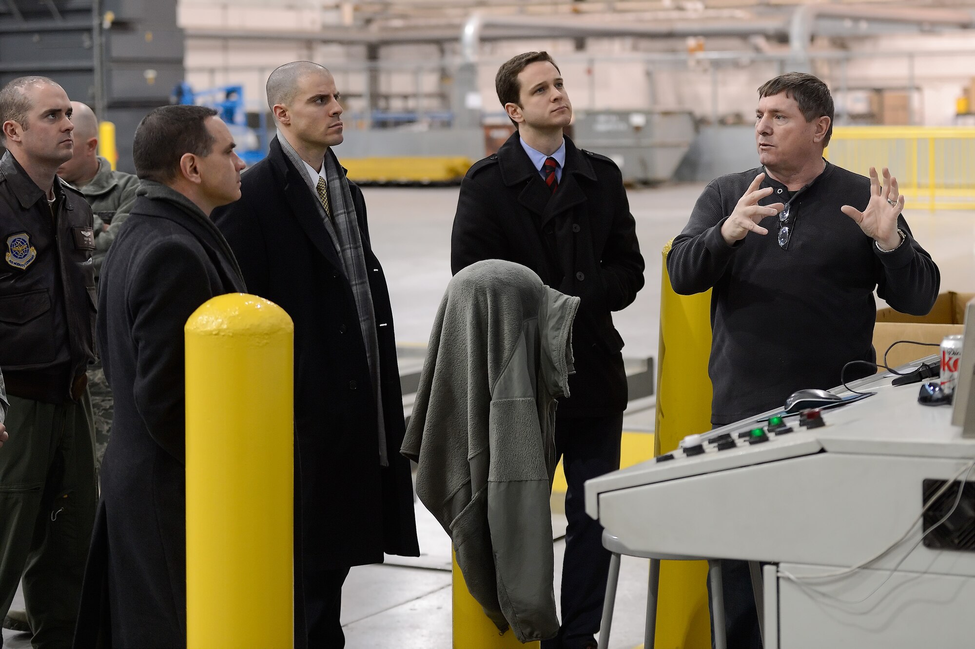 Mike Williams, 436th Aerial Port Squadron, air freight operations manager, briefs staff members from U.S. Sen. Chris Coons??? office on the cargo management system inside the 'Super Port' during a tour of the facility Feb. 9, 2015, at Dover Air Force Base, Del. Williams explained how the storage and load-planning system's inherent efficiencies maximize the overall tonnage-per-mile at low cost. (U.S. Air Force photo/Greg L. Davis)