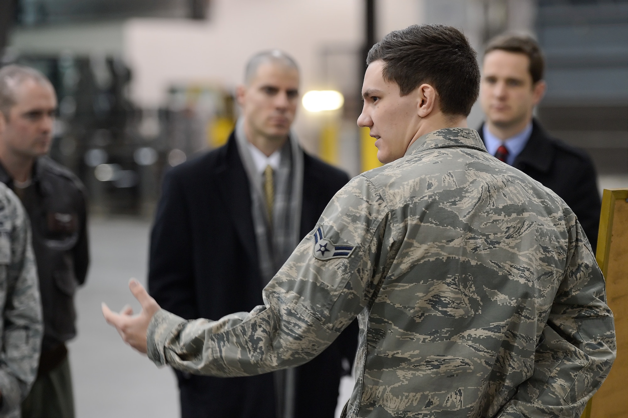 Airman 1st Class Justin Ford, 436th Aerial Port Squadron, briefs staff members from U.S. Sen. Chris Coons??? office on the mission of the 'Super Port' during a tour of the facility Feb. 9, 2015, at Dover Air Force Base, Del. During their visit, the staff members toured the Wing's aircraft, major organizations and facilities to better understand Team Dover capabilities. (U.S. Air Force photo/Greg L. Davis)