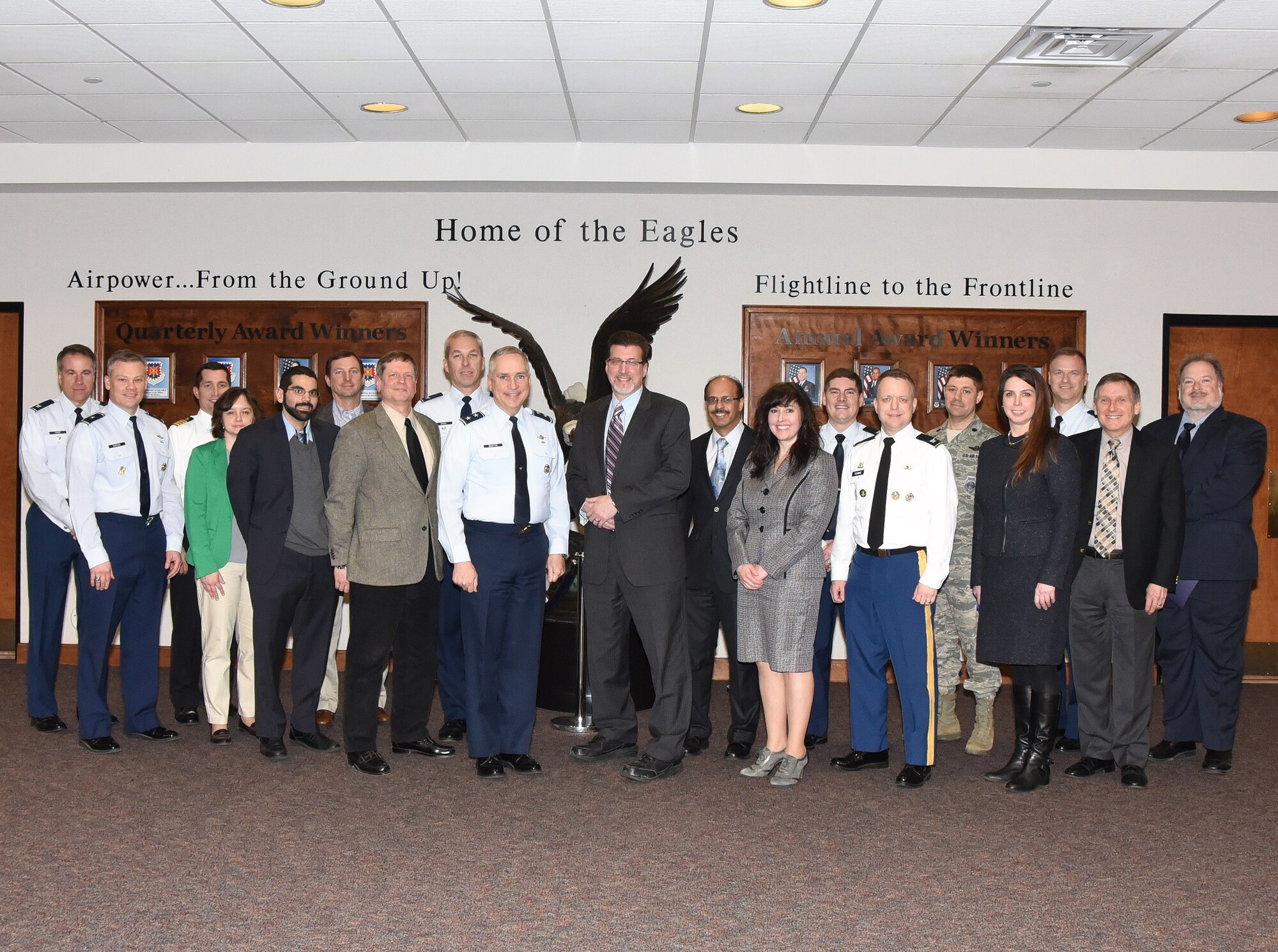 Visitors from Burlington County College pose for a photo with U.S. Air Force Expeditionary Center and Joint Base McGuire-Dix-Lakehurst leaders during a visit to the USAF EC Feb. 12. The visit included and an overview of the USAF EC’s mission supporting Air Mobility Command assets around the world.(U.S. Air Force photo/Danielle Brooks)