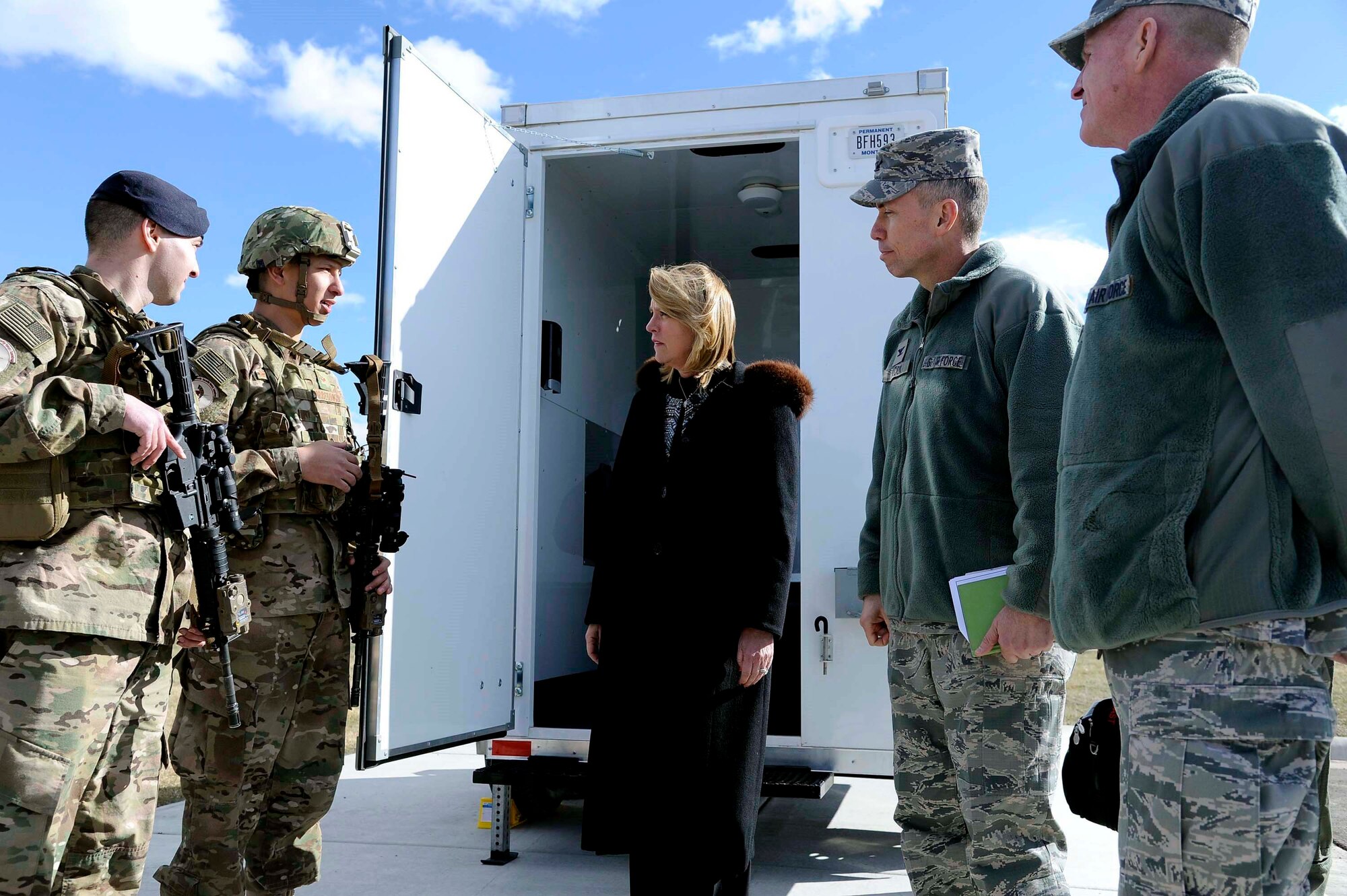 Secretary of the Air Force Deborah Lee James, center, and Lt. Gen. Stephen Wilson, commander of Air Force Global Strike Command, far right, speak with Senior Airmen Jordan Arrendondo and Benny Dorman, 741st Missile Security Forces Squadron members, about the new Model Defender gear provided by AFGSC’s Force Improvement Program Feb. 19. James and Wilson visited Malmstrom to discuss the progress of FIP over the past year. (U.S. Air Force photo/Staff Sgt. Delia Marchick) 