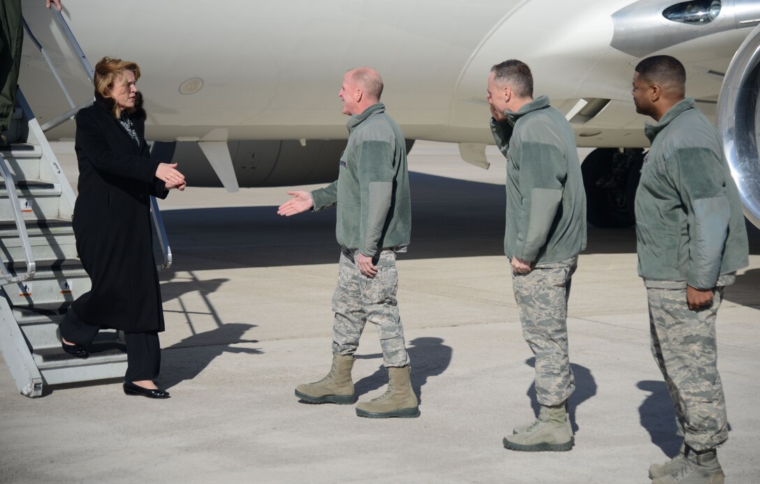 Secretary of the Air Force Deborah Lee James meets with Lt. Gen. Stephen Wilson, Air Force Global Strike Command commander, as she steps off her plane Feb. 19 in Great Falls, Mont. Both James and Wilson visited Malmstrom Air Force Base, Mont., to discuss its mission and to connect with the Airmen stationed there. (U.S. Air Force photo/Airman 1st Class Dillon Johnston)