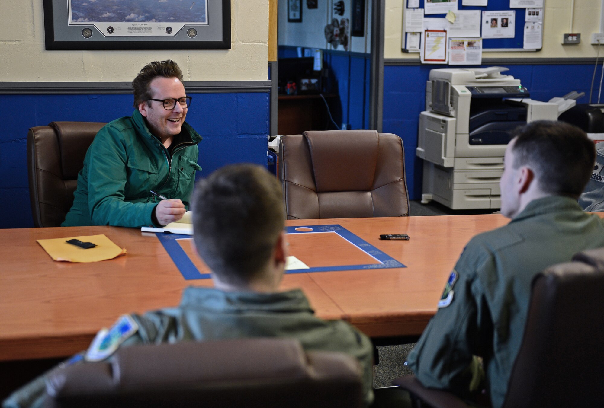 Jason Barlow, editor-at-large for BBC Tog Gear Magazine, interviews Liberty Airmen for a feature in their April issue at Royal Air Force Lakenheath, England, Feb. 19, 2015. Media visited the 48th Fighter Wing to Liberty Airmen and their cars. (U.S. Air Force photo by Airman 1st Class Erin R. Babis/Released)