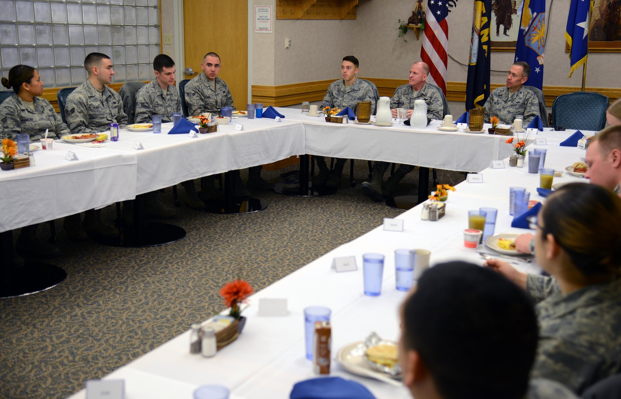 Lt. Gen. Stephen Wilson, right from center, Air Force Global Strike Command commander, speaks with Team Malmstrom Airmen during a breakfast Feb. 19 at Malmstrom Air Force base, Mont. Wilson chatted with the Airmen about the Force Improvement Program, base happenings and their personal lives. (U.S. Air Force photo/Airman 1st Class Dillon Johnston)