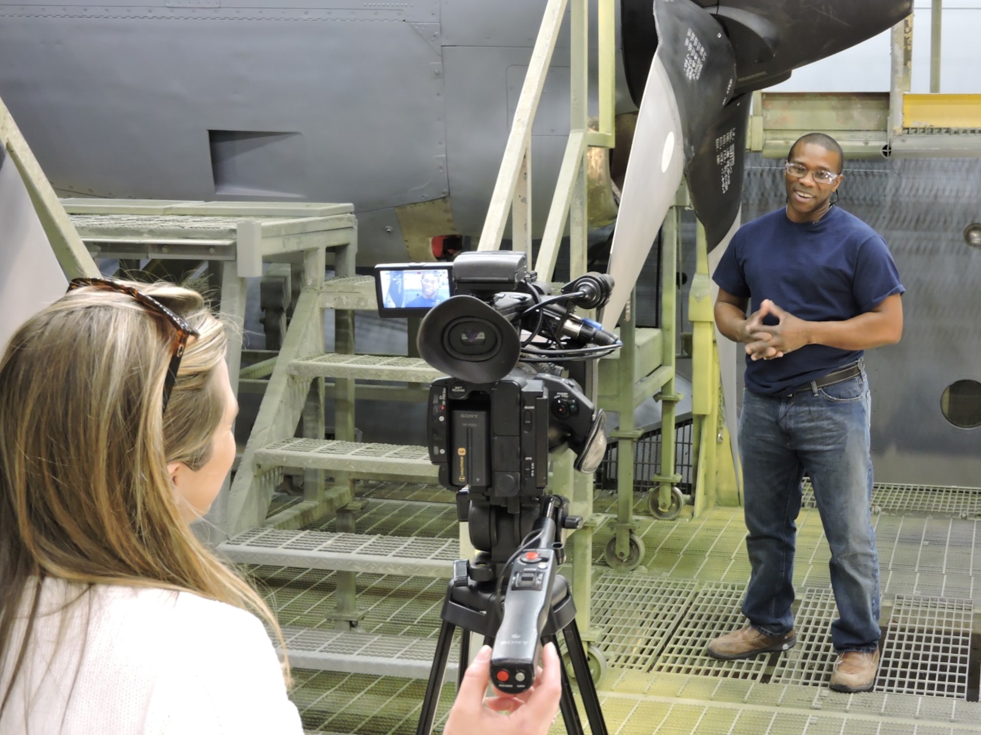 Terry Lowe, C-130 Paint Shop, tells of the pride he has when a newly painted aircraft leaves the hangar to return to service. The 402nd AMXSS Aircraft paint/de-paint process will be featured on 13WMAZ's "Behind the Lines" segment airing Feb. 26 on the 6 p.m. Eyewitness News. (U.S. Air Force photo by Roland Leach) 



