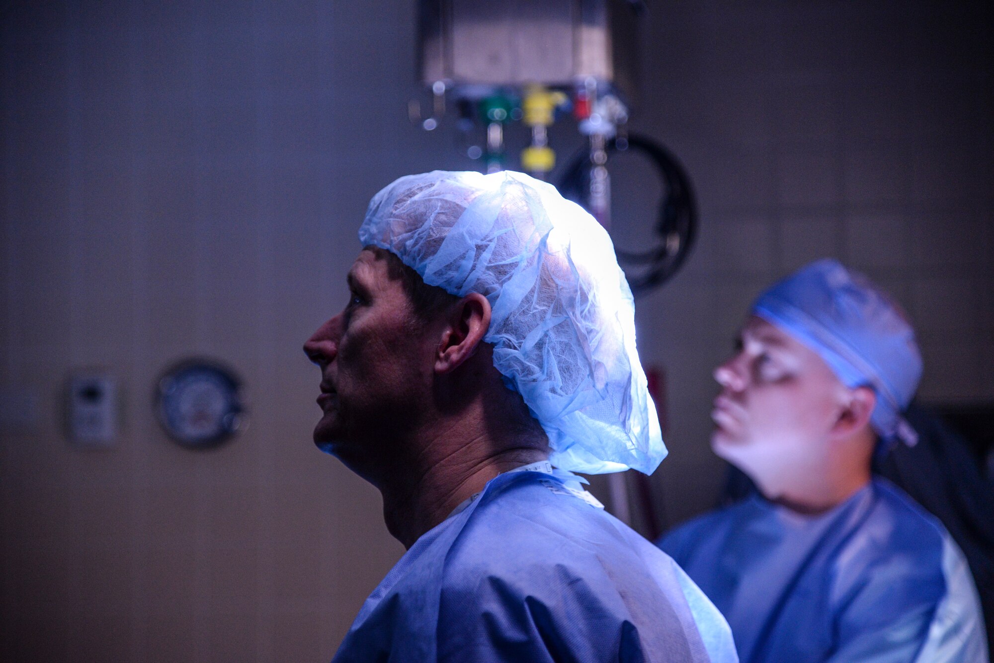 Maj. Alan Sears, general surgeon and student in the Emergency War Surgery Course, listens to instruction during the advanced surgical skills training at Wilford Hall Ambulatory Surgical Center on Joint Base San Antonio-Lackland, Texas, Feb. 11, 2015. The purpose of the Emergency War Surgery Course is to give deploying surgeons some of the basic trauma skills they will need when they deploy downrange. (U.S. Air Force photo/Staff Sgt. Michael Ellis)