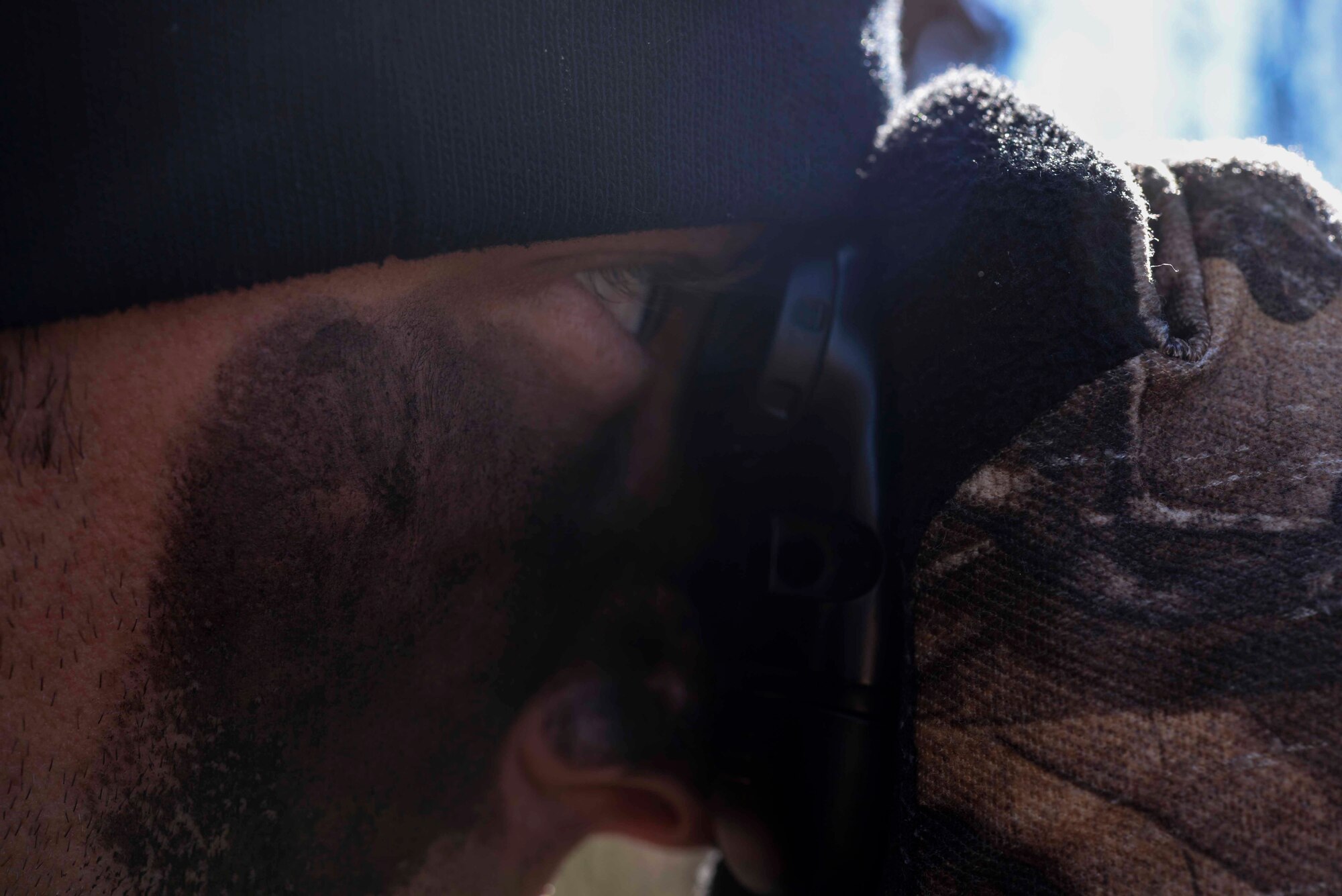 Chaplain Capt. Matthew Spencer looks through his rangefinder Jan. 18, 2015, at Little Rock Air Force Base, Ark. The rangefinder assists the hunter in determining the distance of his targets. (U.S. Air Force photo by Senior Airman Kaylee Clark)