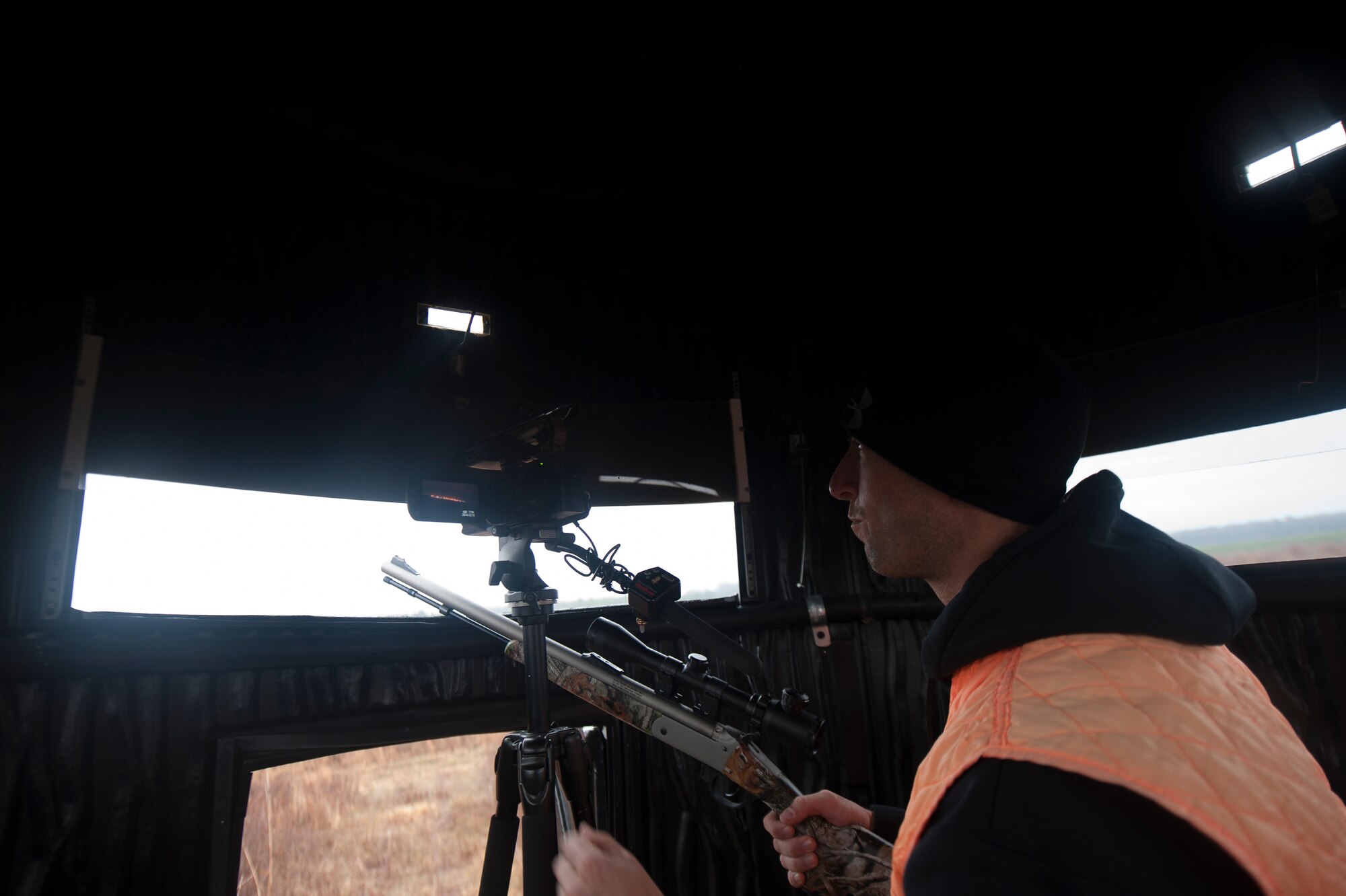 Chaplain Capt. Matthew Spencer looks out into a field waiting on a deer to walk into his sights Dec. 14, 2014, at Little Rock Air Force Base, Ark. Spencer finds himself most connected to God when he is surrounded by the comfort of nature.  (U.S. Air Force photo by Senior Airman Kaylee Clark)