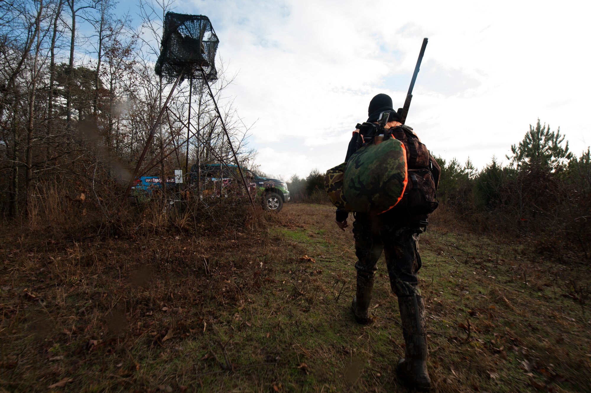 Chaplain Capt. Matthew Spencer walks back to his truck after a rainy morning in the deer stand Dec. 14, 2014, at Little Rock Air Force Base, Ark. Spencer spent his youth hunting with his father, which was the spark that lit his passion for hunting. (U.S. Air Force photo by Senior Airman Kaylee Clark) 