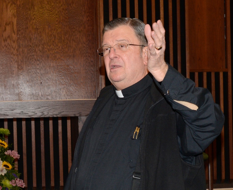 Father Thomas Fey, Robins Chapel Catholic priest, points out some of the facility’s improvements.(U.S. Air Force photo by Ed Aspera)