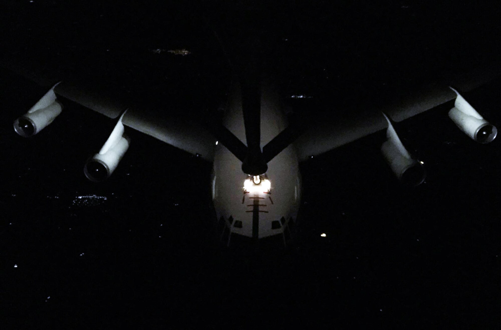 A WC-135 Constant Phoenix aircraft assigned to Offutt Air Force Base, Neb., is refueled by a KC-135 Stratotanker from McConnell Air Force Base, Kan., during a night air refueling exercise, Feb. 19, 2015.  The WC-135W Constant Phoenix atmospheric collection aircraft supports national level consumers by collecting particulate and gaseous effluents and debris from accessible regions of the atmosphere in support of the Limited Nuclear Test Ban Treaty of 1963.  The KC-135 Stratotanker was operated by an aircrew made up of Air Force Reservists from the 18th Air Refueling Squadron, 931st Air Refueling Group, at McConnell.  (U.S. Air Force photo by Senior Master Sgt. Ray Lewis)
 