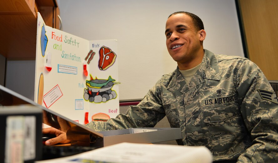 Senior Airman Allen Cherry, 86th Aerospace Medicine Public Health technician, prints files for his food inspector kit at Ramstein Air Base, Germany, Feb. 17, 2015. Cherry was selected as the U.S. Air Force Public Health Airman of the Year for his work with deployed service members and efforts to contain malaria, among other accomplishments. (U.S. Air Force photo/Senior Airman Armando A. Schwier-Morales) 