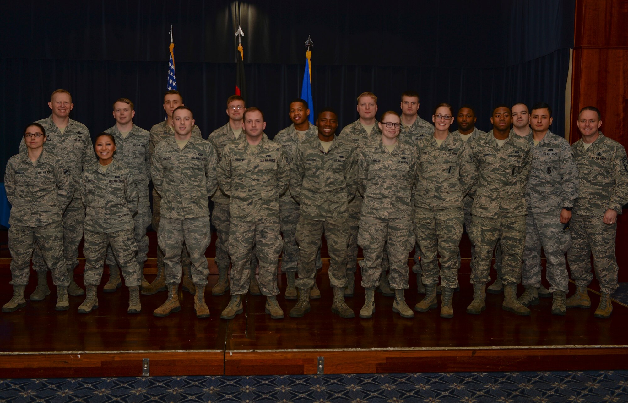U.S. Air Force Col. Joe McFall, 52nd Fighter Wing commander, left, and U.S. Air Force Brian Gates, 52nd FW command chief, right, pose with Airmen during the Diamond Sharp Award recognition breakfast at Club Eifel at Spangdahlem Air Base, Germany, Feb. 19, 2015. The First Sergeants Council sponsored the program which recognizes Airmen for excellence and professionalism. (U.S. Air Force photo by Staff Sgt. Joe W. McFadden/Released)
