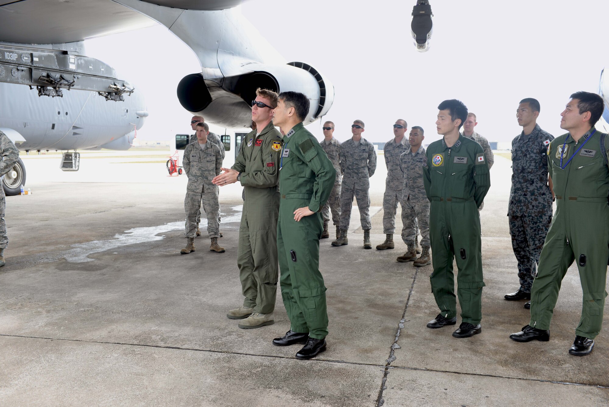 Lt. Gen. Yoshinari Marumo, Western Air Self-Defense Force commander, receives a briefing from B-52 Stratofortress pilots and crewchiefs on the aircraft during a tour of the base Feb. 19, 2015, at Andersen Air Force Base, Guam. The Japan Air Self-Defense Force has approximately 20 different aircraft deployed here in support of Cope North 2015, a multilateral training exercise which is a long-standing, multinational event designed to increase interoperability and improve combat readiness and develop a synergistic disaster response capability between the countries involved. (U.S. Air Force photo by Senior Airman Cierra Presentado/Released)