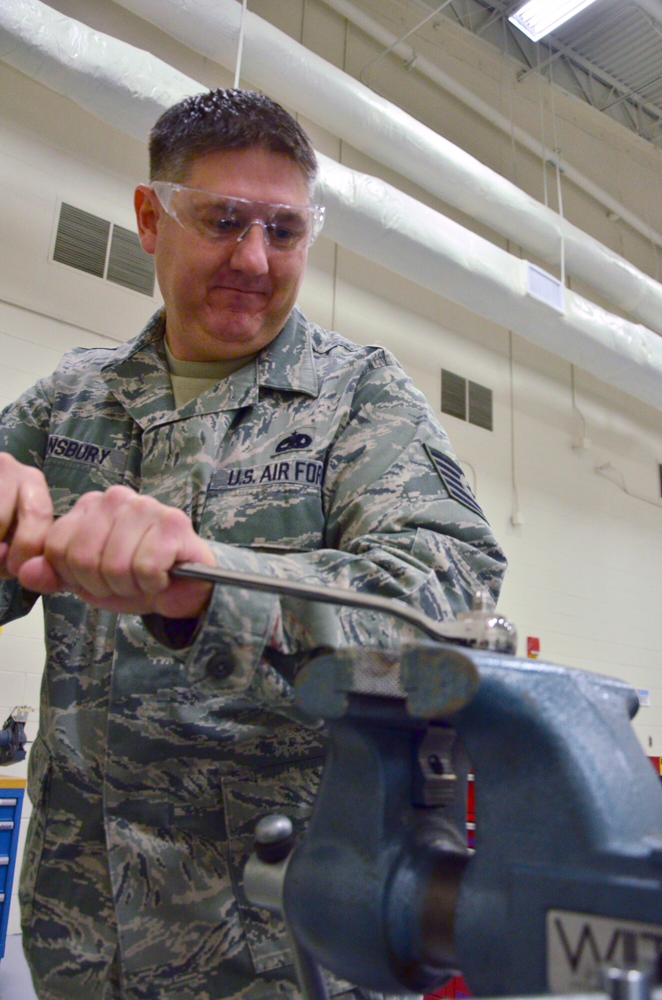 Tech Sgt. Michael Stansbury, a crew chief with the 403rd Aircraft Maintenance Squadron works to open the valve that is getting blocked by corrosion, which is causing pressurization issues in the C-103J aircraft 10 Feb. (U.S. Air Force Photo/Master Sgt. Brian Lamar) 
