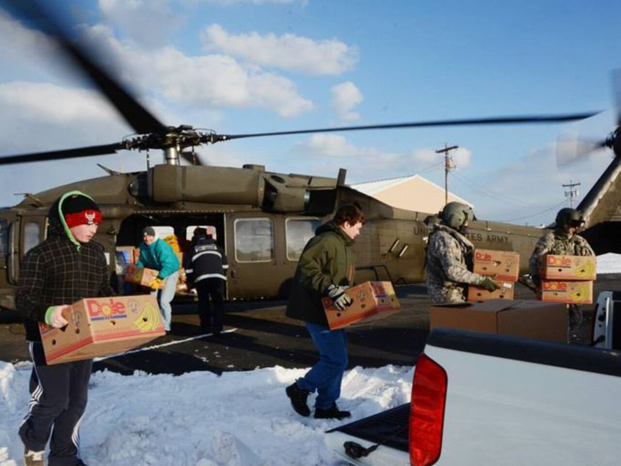 A Virginia Army National Guard aviation crew from the Sandston, Va.-based 2nd Battalion, 224th Aviation Regiment delivers food, mail and medicine to Tangier Island, Va., Feb. 19, 2015. The 1.2-square-mile island has been iced-in since recent frigid weather made routine seaport deliveries impossible. U.S. Army photo by Staff Sgt. Terra C. Gatti
